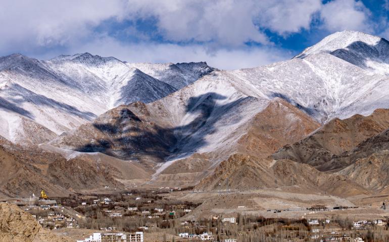 View of Leh city with the majestic Himalayan mountains in the background.