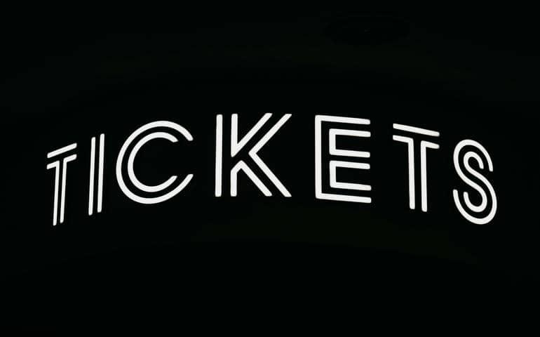 Tickets on black background