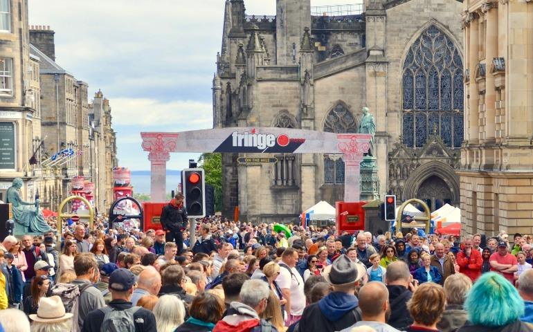 Crowds of tourists and Festival tourists on the Royal Mile for the Edinburgh annual Fringe Festival