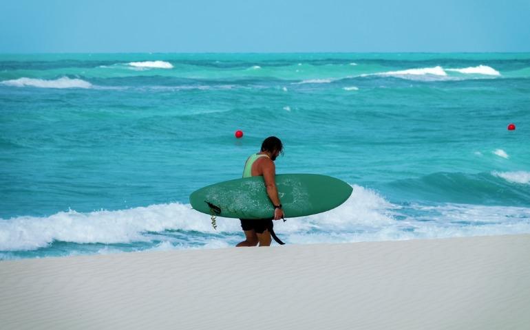 A surfer at the beach in Abu Dhabi