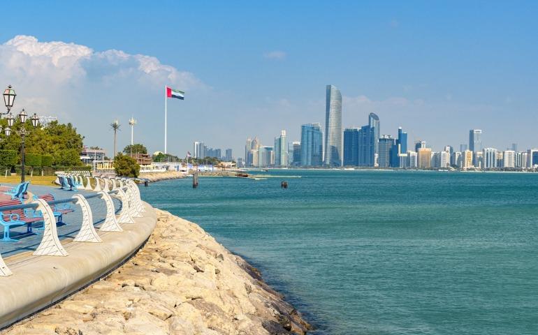 Abu Dhabi city skyline under a clear blue sky