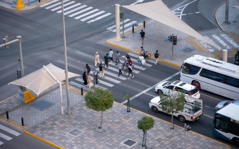 Pedestrians crossing the streets in Abu Dhabi city
