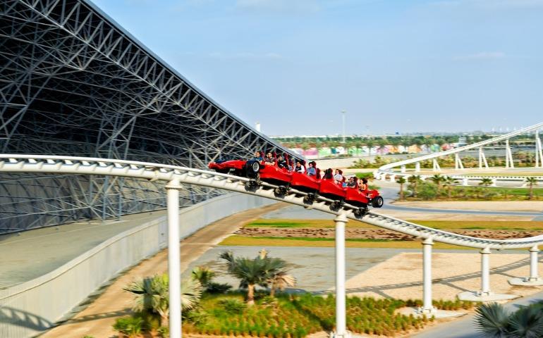 Travellers enjoy a thrilling ride on the roller coaster at Ferrari World in Abu Dhabi.