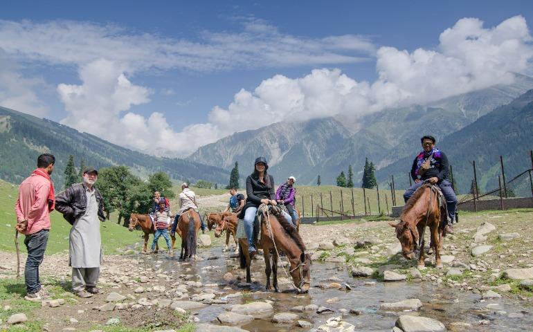 Tourists riding horses at the Sonmarg Valley