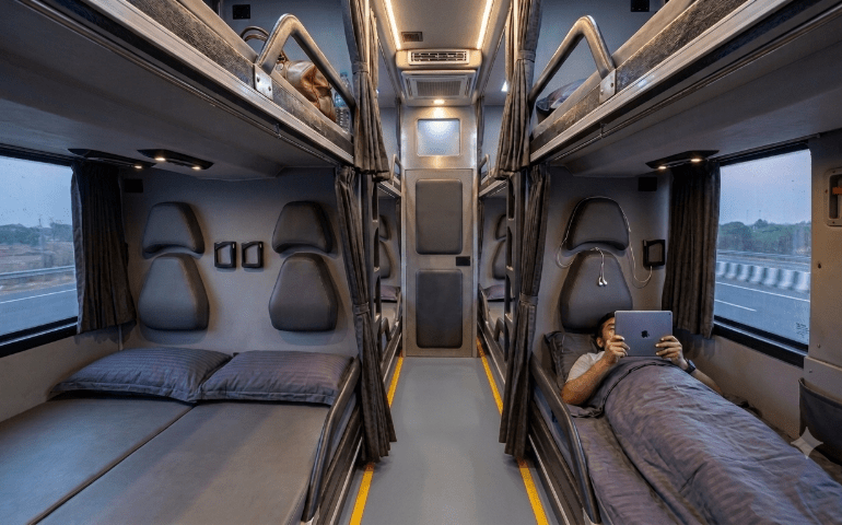 A person enjoying a bus ride in a sleeper bus