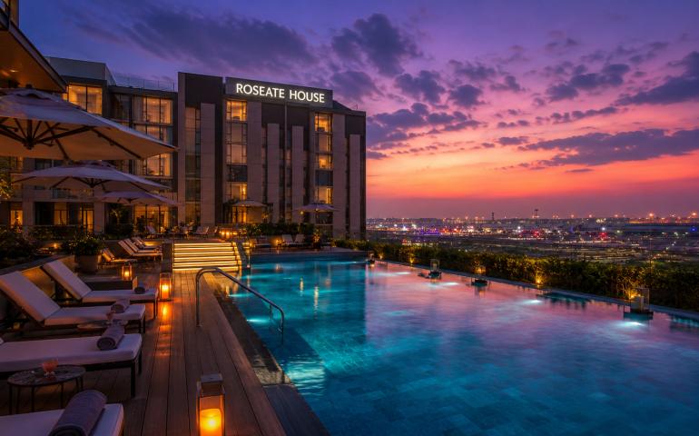 Roseate House pool glowing at dusk