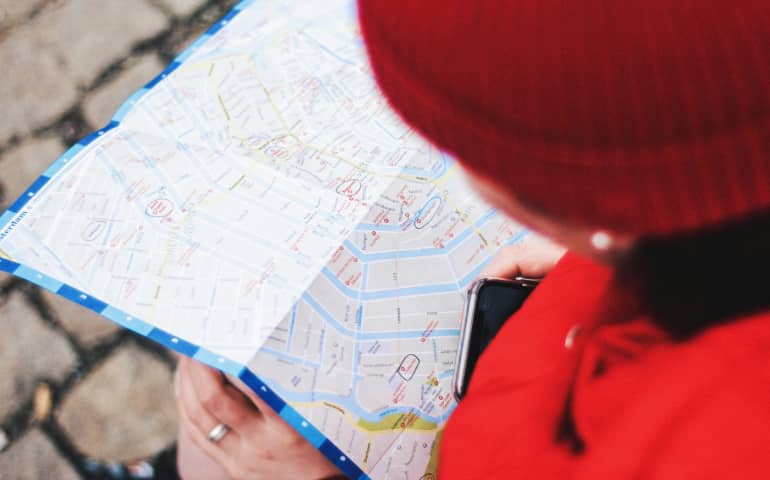 A girl reading Amsterdam map