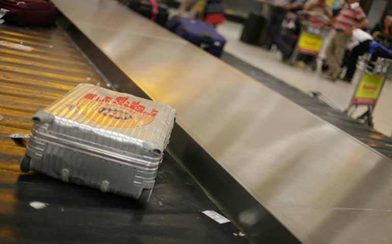 Grey bag on airport luggage belt