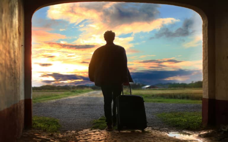 A solo traveller with his luggage