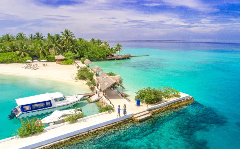 Speedboats near the Maldives island with clear waters
