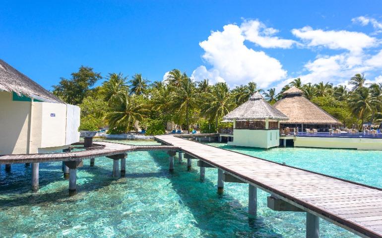 Overwater bungalows and crystal-clear waters in the Maldives.