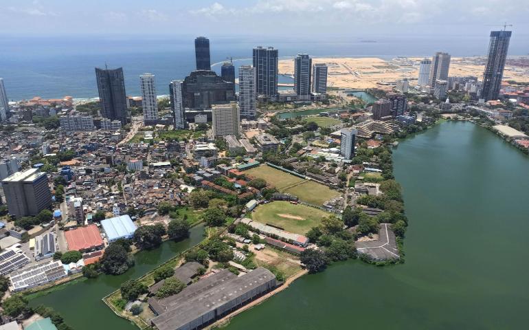 Stunning aerial view capturing Colombo's skyline, oceanfront, and Beira Lake.