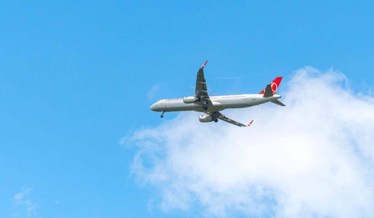 An aeroplane flying high in the sky with a clear,
Image Credit: Oktay Köseoğlu/Pexels