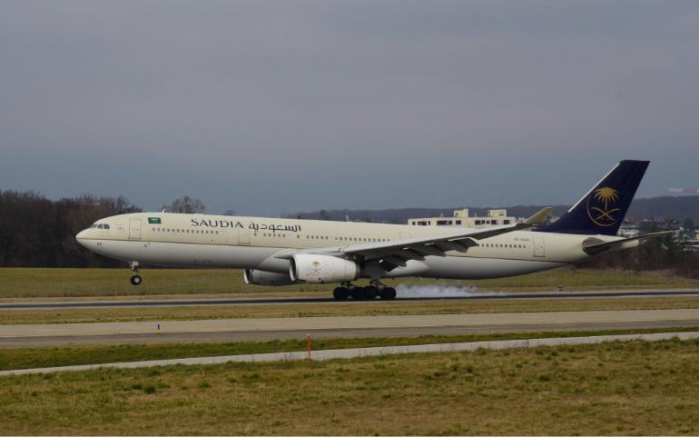 Saudia Airlines aircraft safely lands on a cloudy day in Geneva