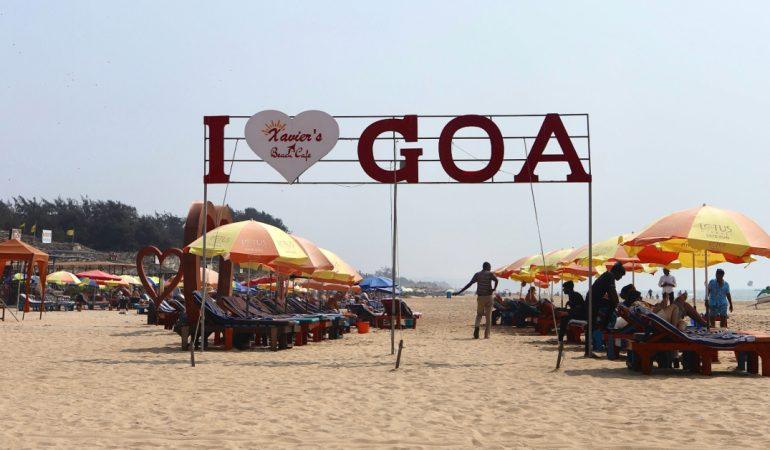 Relaxing beach scene in Goa, India, featuring colorful umbrellas and a sign reading 'I Heart Goa'

Ritesh Mitha/Pexels