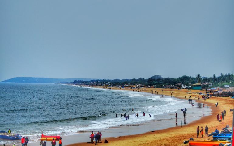 Explore the vibrant sands and lively atmosphere of Candolim Beach in Goa.