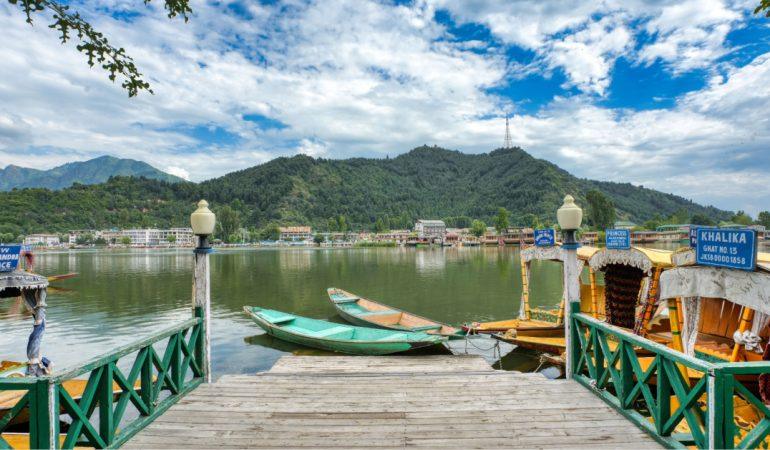 Dal Lake's serene beauty captured from a wooden dock with vibrant shikaras.
Shah Faizan/Pexels