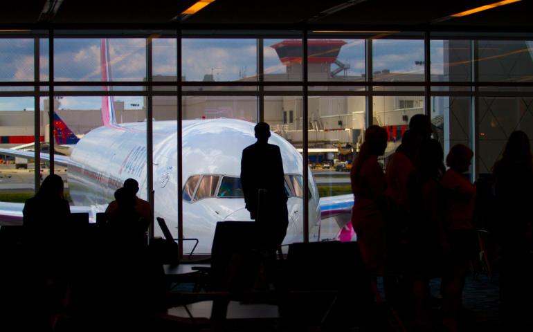 Tavellers waiting at an airport terminal
Image Credit - Ivan Shimko/Unsplash
