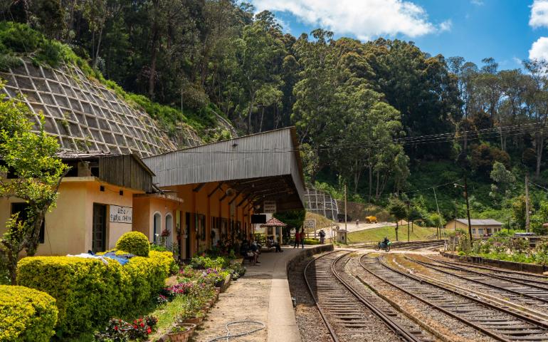 View of the railway station surrounded by lush greenery in Nuwara Eliya, Sri Lanka.