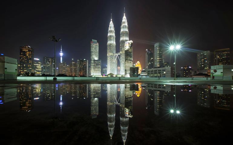 Kuala Lumpur's skyline featuring city lights and reflections.
Image Credit - Zukiman Mohamad/Pexels