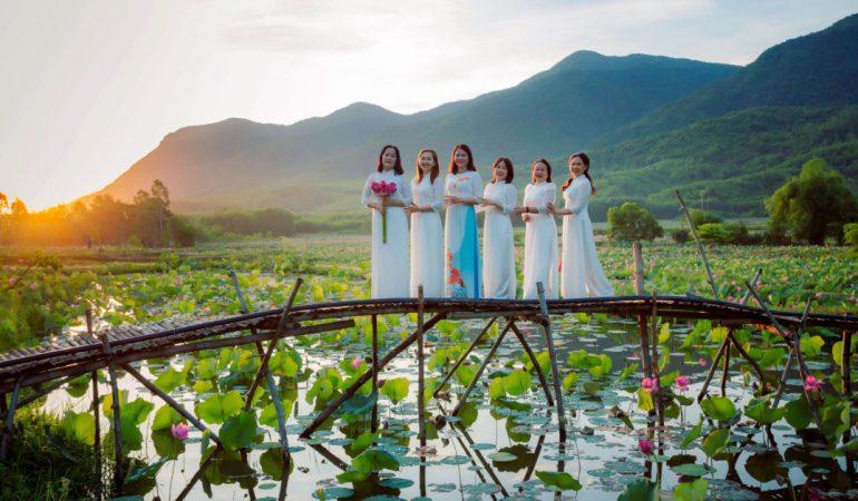 A group of women standing on a lotus bridge at sunset in Hội An, Vietnam
Image Credit: Võ Văn Tiến/Pexels