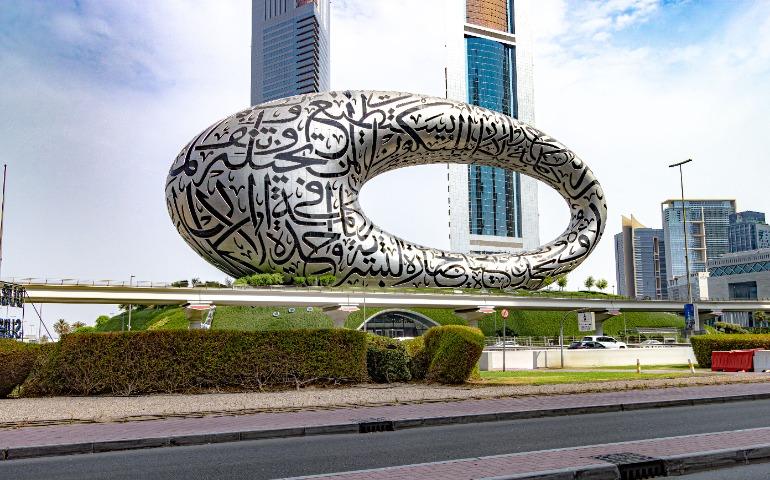 Stunning view of the futuristic Museum of the Future in Dubai with Arabic calligraphy.