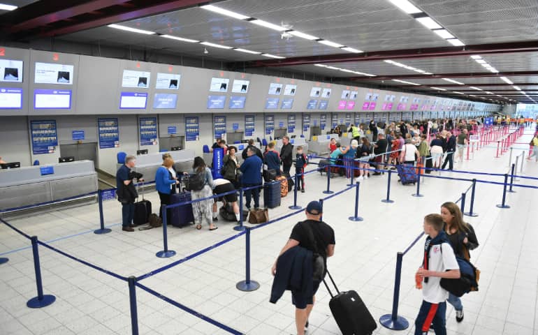 People standing in queue for immigration