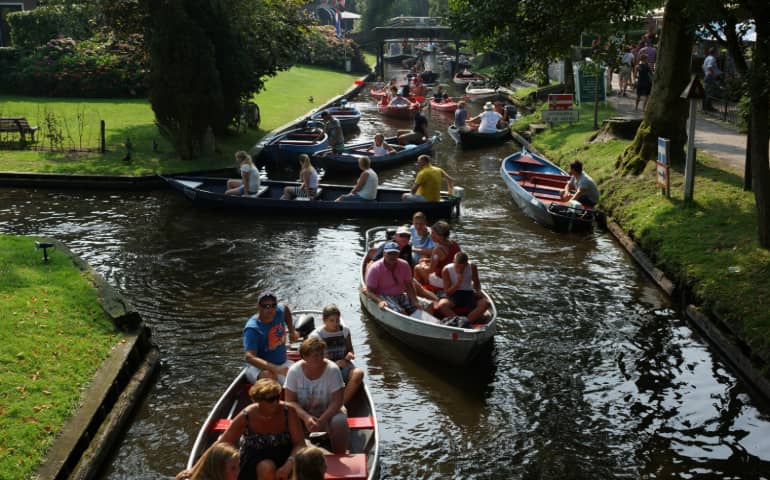 People enjoying boat ride in Giethoorn