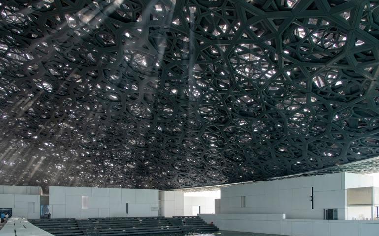 View of exhibition building under roof of museum The Louvre Abu Dhabi