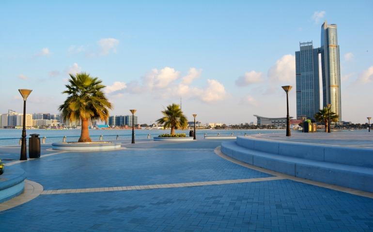 The Corniche waterfront promenade at early sunset time