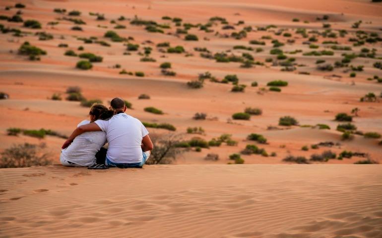 A couple in the Liwa Desert, Abu Dhabi, United Arab Emirates