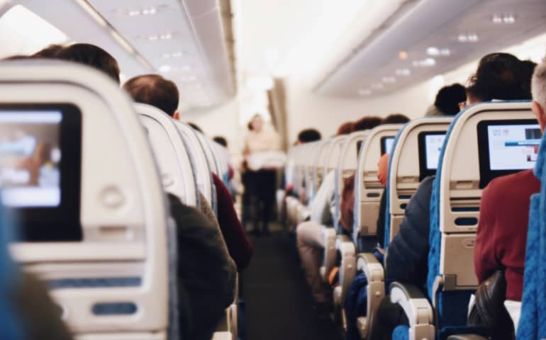 Passengers sitting inside a plane
