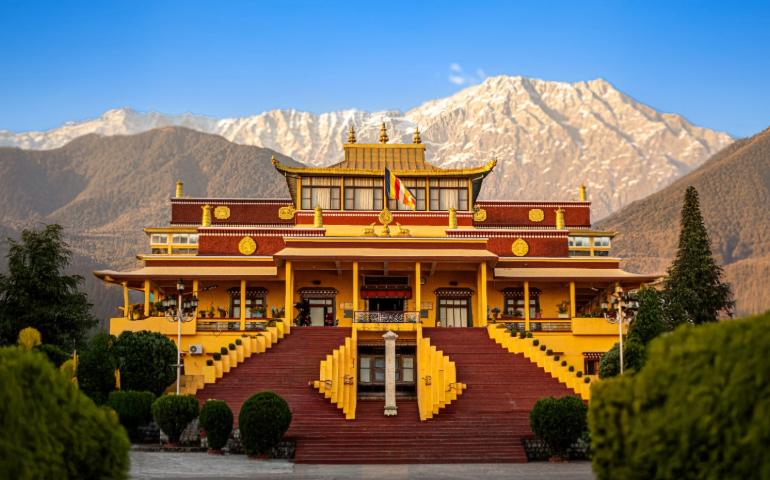 A vibrant, symmetrical view of a Tibetan Buddhist Monastery in the Dharamshala.
Image Credit - StockPitstop/Shutterstock