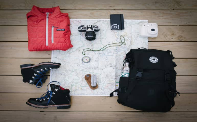 A bag with clothes and shoes outside