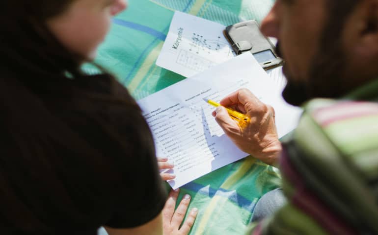 Parents making a checklist for their holiday
