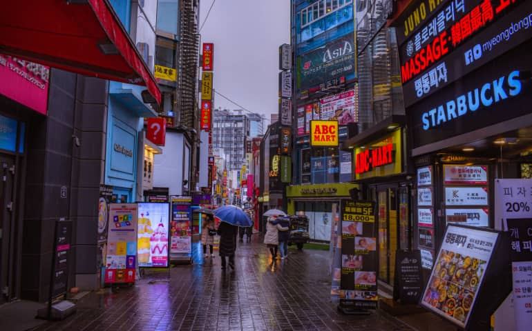 People walking on the Myeongdong Street for shopping
