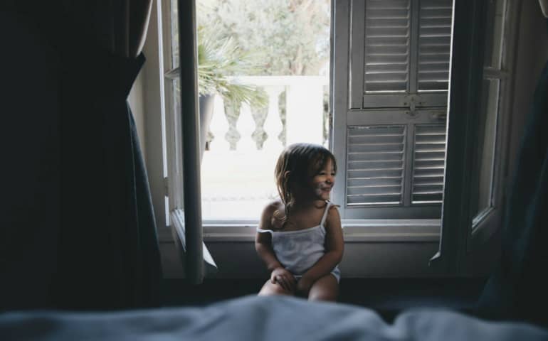 Kid enjoying in a hotel room