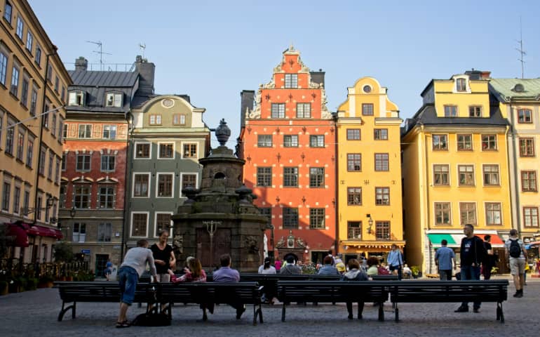 People sitting on benches in Gamla Stan