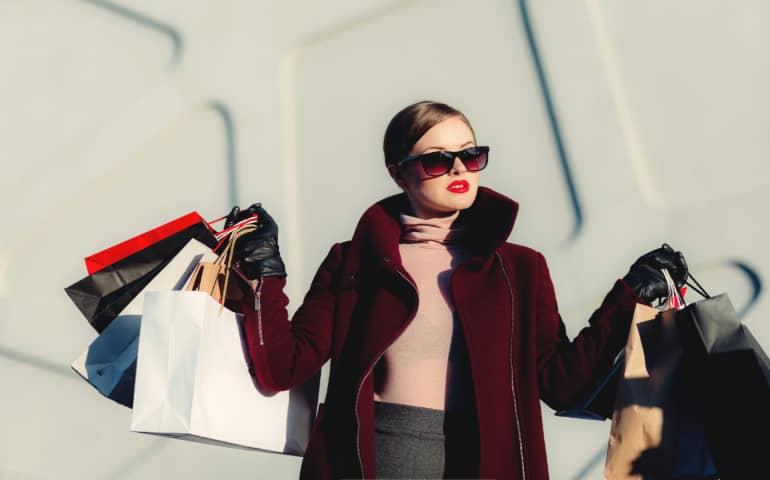 A woman with many shopping bags
