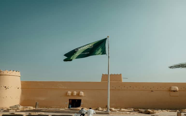 Saudi Arabia flag on ancient fortress