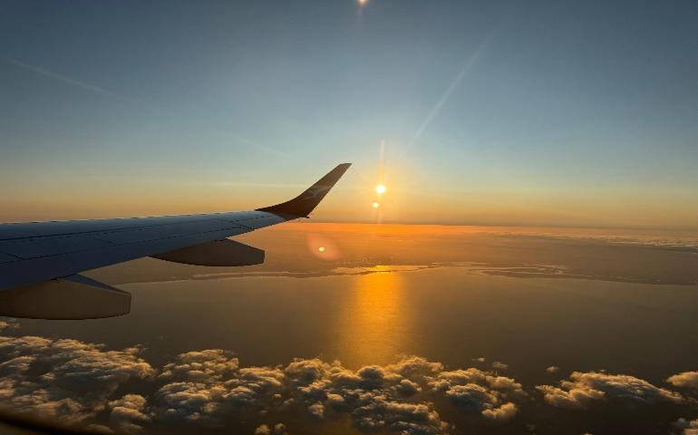 Capture of a mesmerizing ocean sunset viewed from an airplane window during flight
Image Credit: Akshaya Nandyala/Pexels