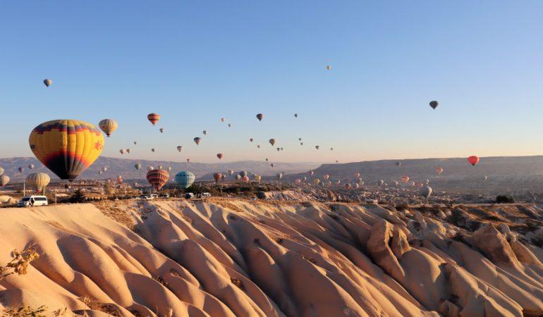 Hot air balloons floating over Cappadocia's scenic rock formation
Image Credit: Alan Wang/Pexels