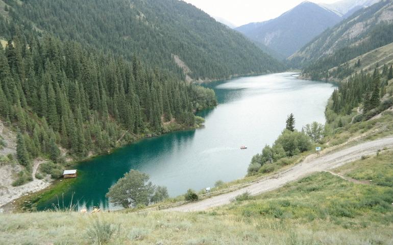 Kolsai lake with lush green forests and a winding river
Image Credit: Alexey Demidov/Pexels