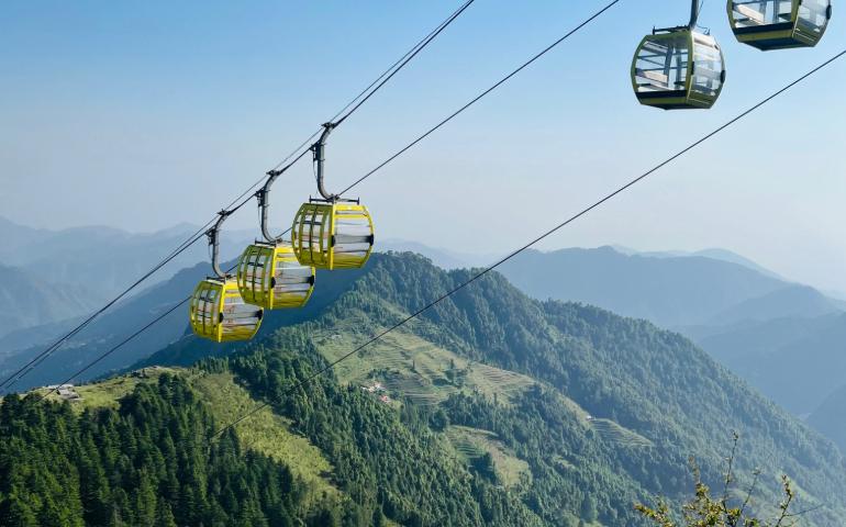 A breathtaking view of cable cars traversing the lush green mountains of Mussoorie, India.
Image Credit: Anurag Gusain/Pexels