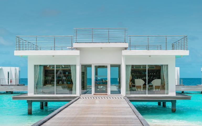 Overwater villa showcasing modern architecture and luxury on a tropical island
image Credit: Asad Photo Maldives/Pexels