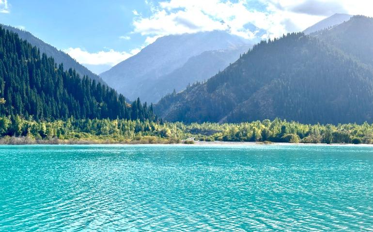 Beautiful turquoise lake surrounded by mountains and forests in Kazakhstan
Image Credit: Ekaterina/Pexels