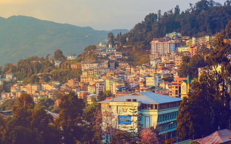 Stunning view of Gangtok, Sikkim at sunset showcasing vibrant urban landscape and scenic hills.
Image Credit - Harsh Suthar/Pexels