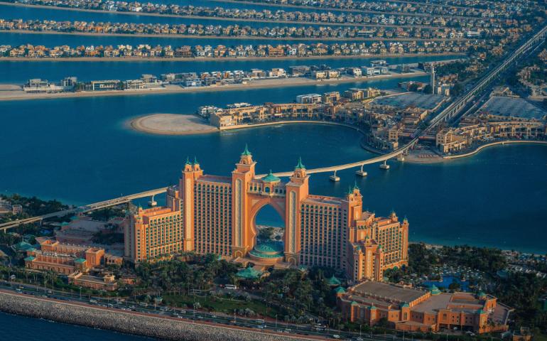 An aerial view of Atlantis, Palm Resort, with surrounding water and palm-shaped islands in Dubai.
Image Credit: Lloyd Alozie/Pexels