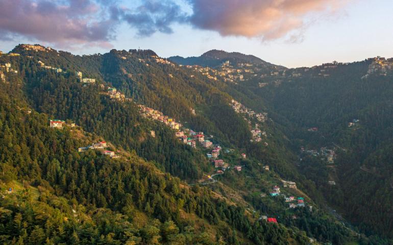 Breathtaking view of Shimla's lush green mountains with scattered houses during sunrise.
Image Credit - Ibrahim Bennett/Pexels