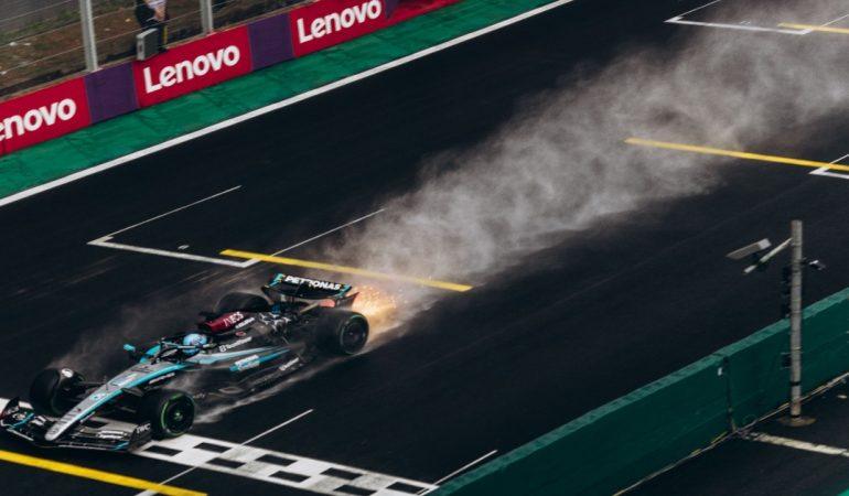 Formula 1 car speeding across a wet track creating a spray of water
Image Credit: Jonathan Borba/Pexels